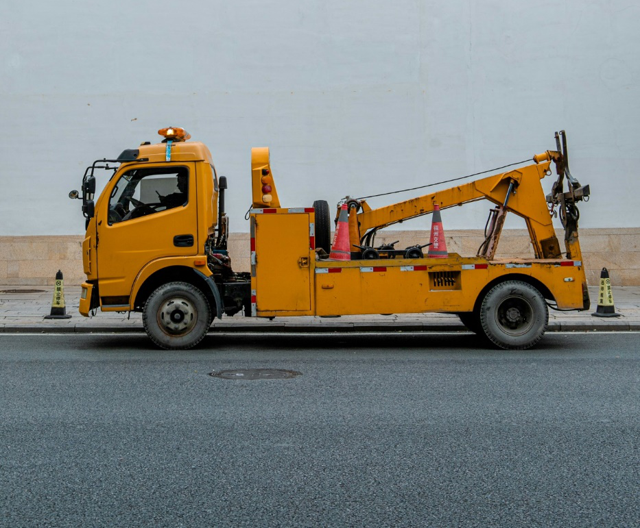 A yellow heavy-duty tow truck